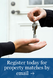 photo of a person handing over keys to new house